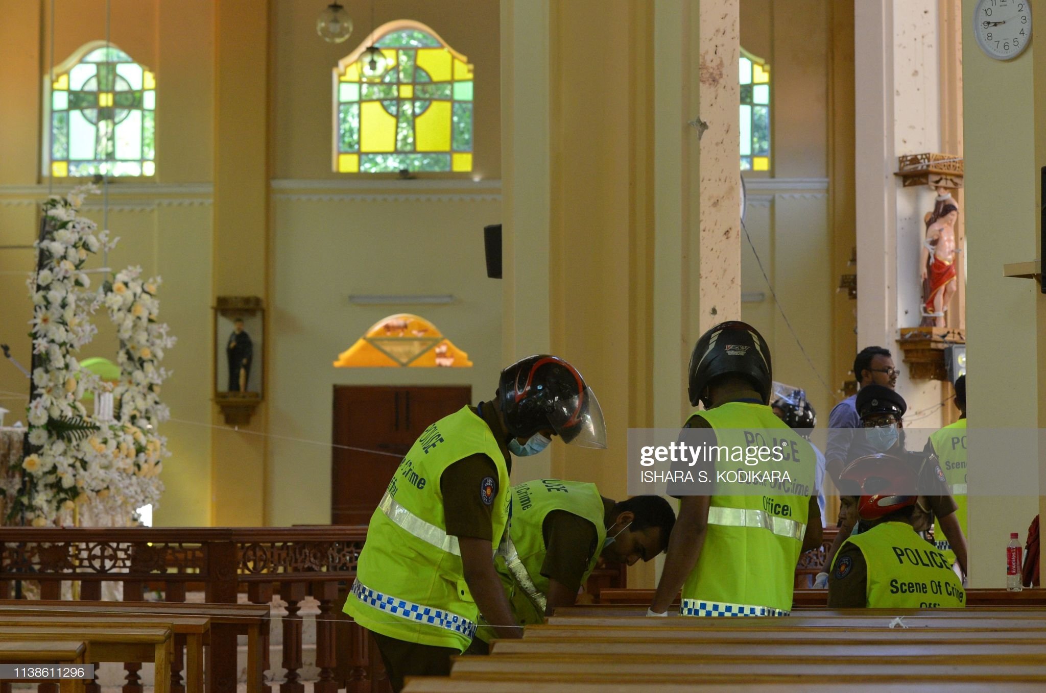 Security personnel inspect the interior of St. Sebastian's Church in Negombo on April 22, 2019, a day after the church was hit in series of bomb blasts targeting churches and luxury hotels in Sri Lanka. - The death toll from bomb blasts that ripped through churches and luxury hotels in Sri Lanka rose dramatically April 22 to 290 -- including dozens of foreigners -- as police announced new arrests over the country's worst attacks for more than a decade. (Photo by ISHARA S. KODIKARA / AFP)        (Photo credit should read ISHARA S. KODIKARA/AFP/Getty Images)